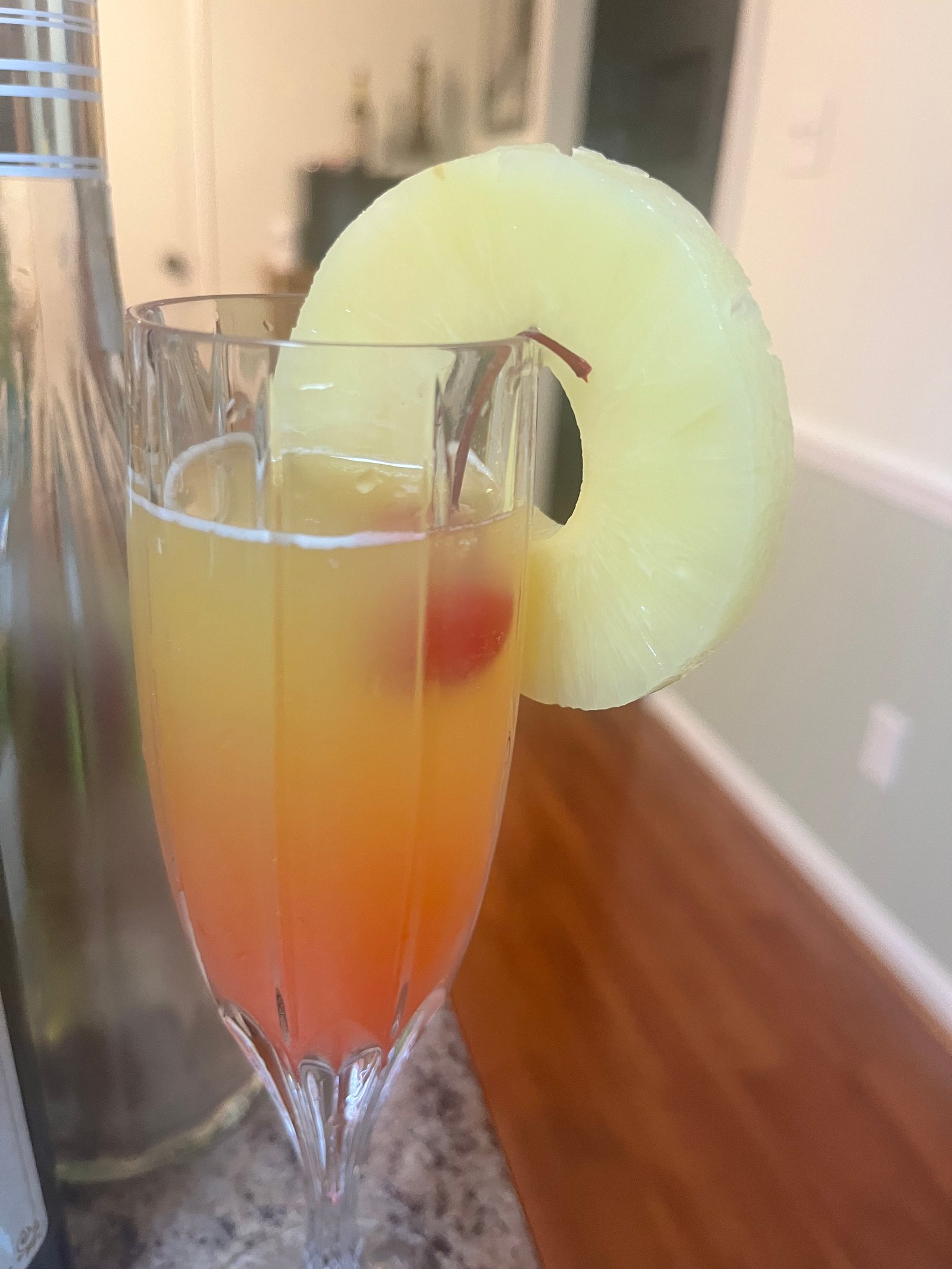 Mimosa with pineapple garnish