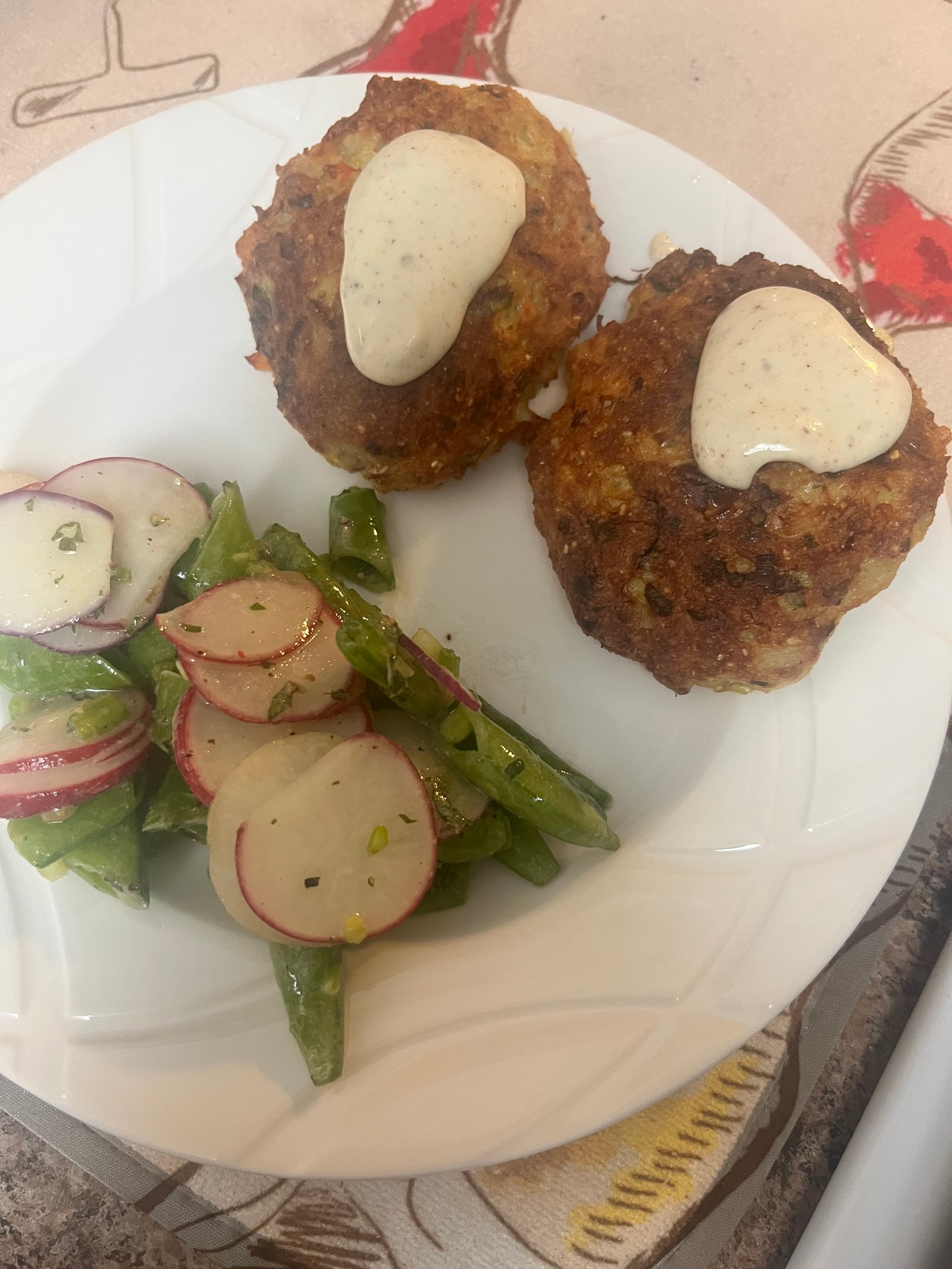 Crab cakes with green bean and radish salad